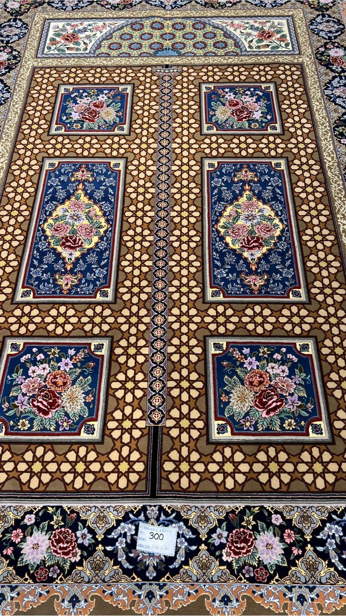 Authentic Persian carpet with central floral motifs.